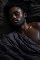 man sleeping peacefully in bed photo