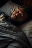 man sleeping peacefully in bed photo