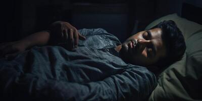 man sleeping peacefully in bed photo