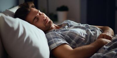 man sleeping peacefully in bed photo