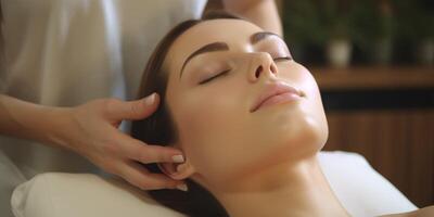 woman in spa salon working with facial skin photo