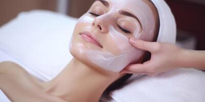 woman in spa salon working with facial skin photo