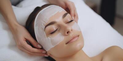 woman in spa salon working with facial skin photo