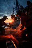 catching seafood in the ocean on boats photo