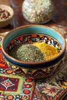 Ceramic bowl with mixed spices photo