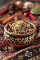 Ceramic bowl with mixed spices photo