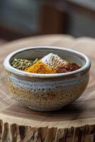 Ceramic bowl with mixed spices photo