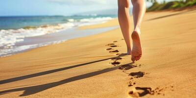 female feet in the sand on the beach photo