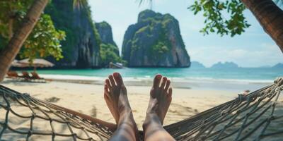 female feet in the sand on the beach photo