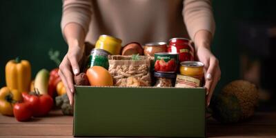 Donation of volunteer assistance boxes with clothing products to the poor photo