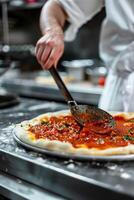 chef makes pizza photo