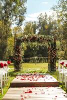 Floral wedding arch in nature photo