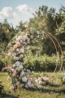 Floral wedding arch in nature photo