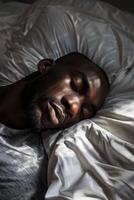 man sleeping in bed photo