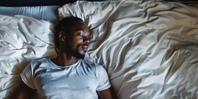 man sleeping in bed photo