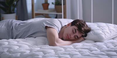 man sleeping in bed photo