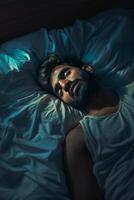 man sleeping in bed photo