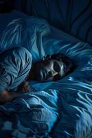 man sleeping in bed photo