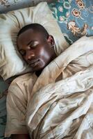 man sleeping in bed photo