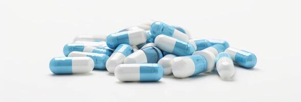 antibiotic capsule pills on white background. Pile of antibiotic drug photo