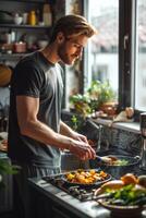 man cooking in the kitchen photo