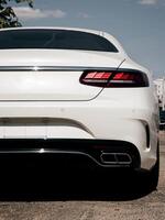 luxury car parked in street photo