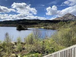 A view of Loch Lomond in Scotland on a sunny day photo
