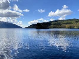 A view of Loch Lomond in Scotland on a sunny day photo