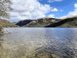 A view of Loch Lomond in Scotland on a sunny day photo