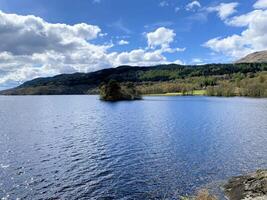 A view of Loch Lomond in Scotland on a sunny day photo