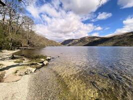 A view of Loch Lomond in Scotland on a sunny day photo