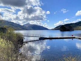 A view of Loch Lomond in Scotland on a sunny day photo