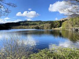 A view of Loch Lomond in Scotland on a sunny day photo