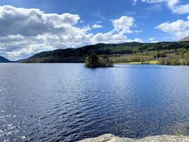 A view of Loch Lomond in Scotland on a sunny day photo