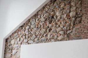 Loft room with stone wall photo