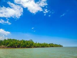 landscape photography of ocean atmosphere with a bright blue sky background photo