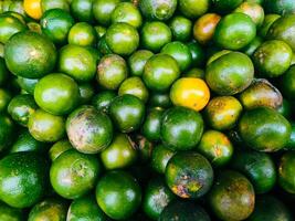 fotografía de cerca arriba textura antecedentes de pila de verde naranja Fruta foto