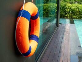 Safety rescue water emergency circle lifebuoy ring summer season rubber security buoy inflatable float swim vacation sea pool copy space equipment travel holiday vacation help beach survival protect photo