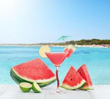 Drink of watermelon juice with lime slice. photo