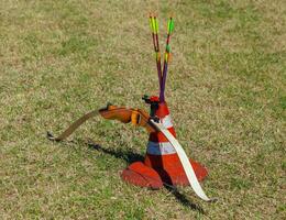 Bow and arrow in a cone. photo