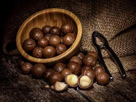 Macadamia nuts on wooden table. photo