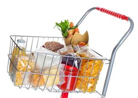 Shopping cart full with food products photo