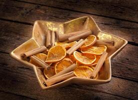 Centerpiece Christmas with orange slices and cinnamon photo