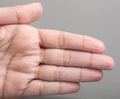Wrinkled skin of the hands photo