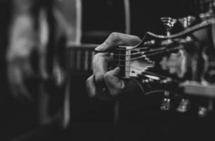 Playing classic guitar. Selective focus. photo