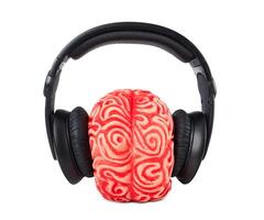 Human brain rubber with headphones photo