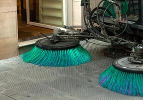 Street sweeper machine cleaning the streets photo