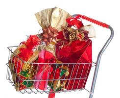 Shopping cart with Christmas gifts photo