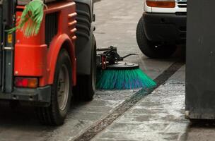 Street sweeper machine cleaning the streets photo