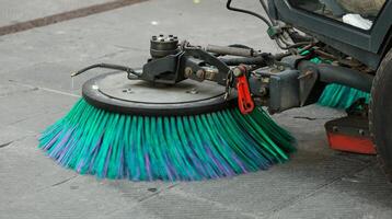 Street sweeper machine cleaning the streets photo